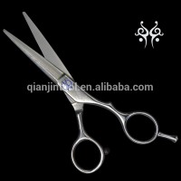 Hair dressing scissor made of Damascus steel